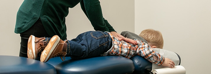 Chiropractor Eau Claire WI Dr. Danielle Knetter Adjusting Patient Chiropractor Eau Claire WI Dr. Danielle Knetter Adjusting Patient